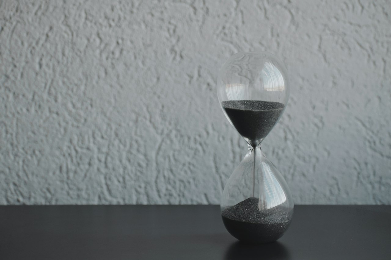 Hourglass representing temporary short-term health coverage