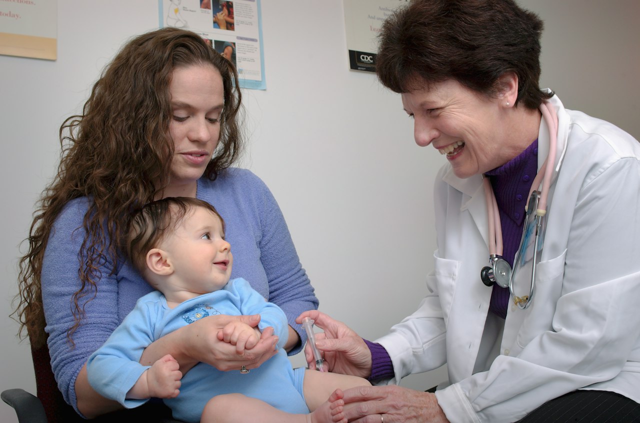 Pediatrician giving a baby a vaccine