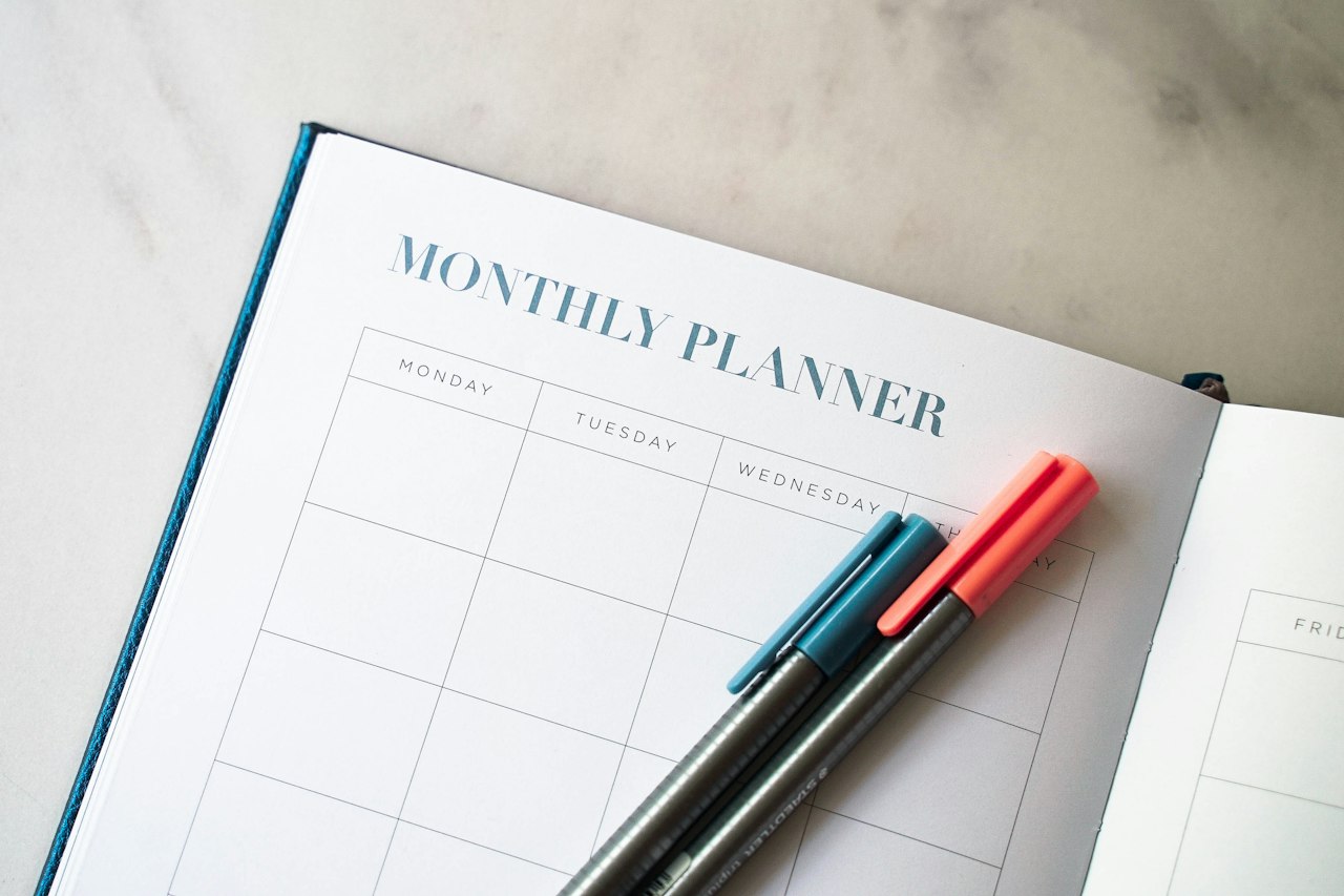 Planner with pens for tracking Medicare enrollment deadlines