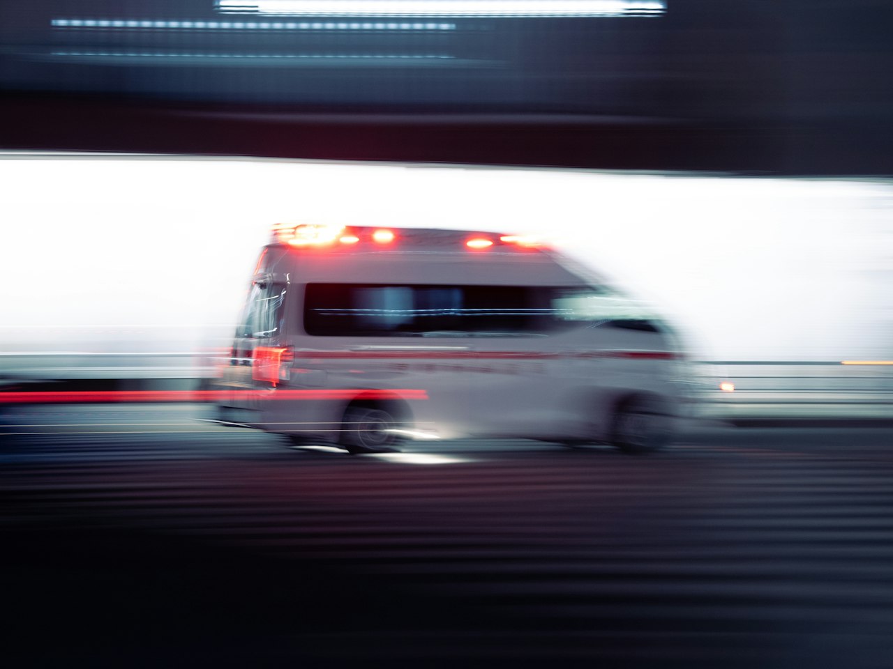 Ambulance driving with emergency lights on