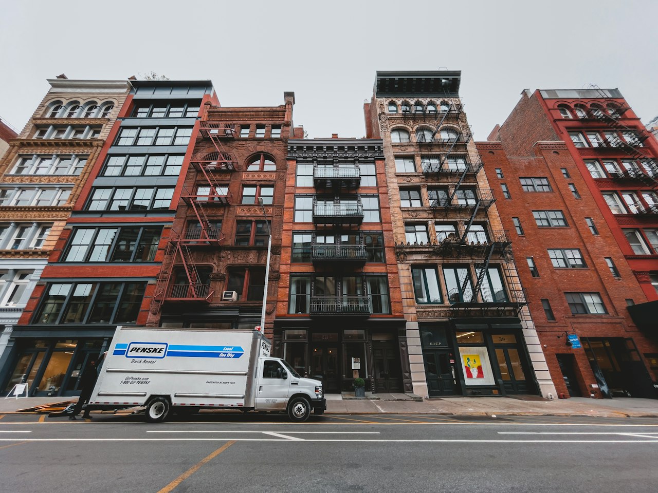 Moving truck parked in front of a building