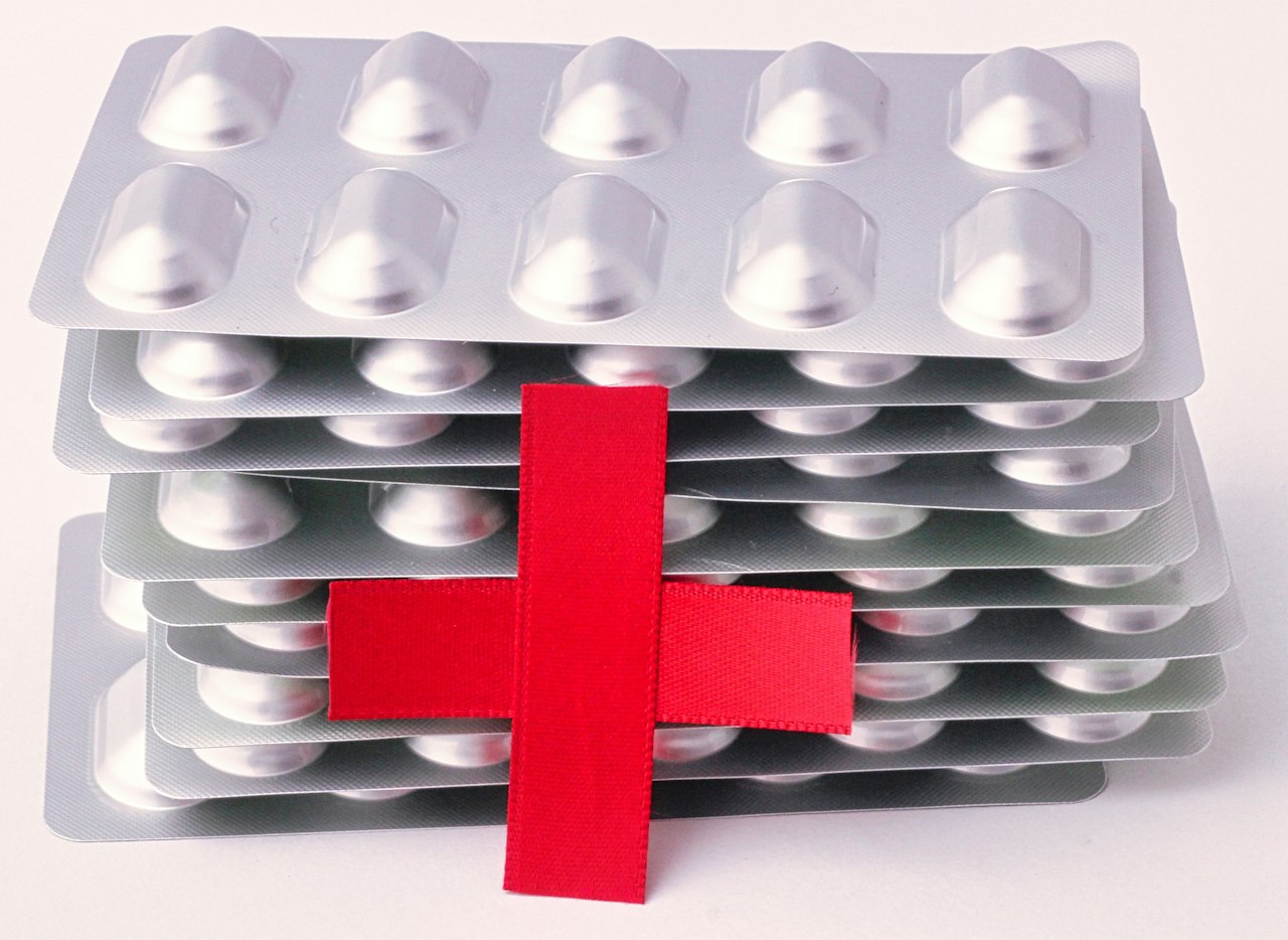 Red cross symbol with first aid medicine supplies